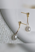 Pendientes largos de perla en dorado