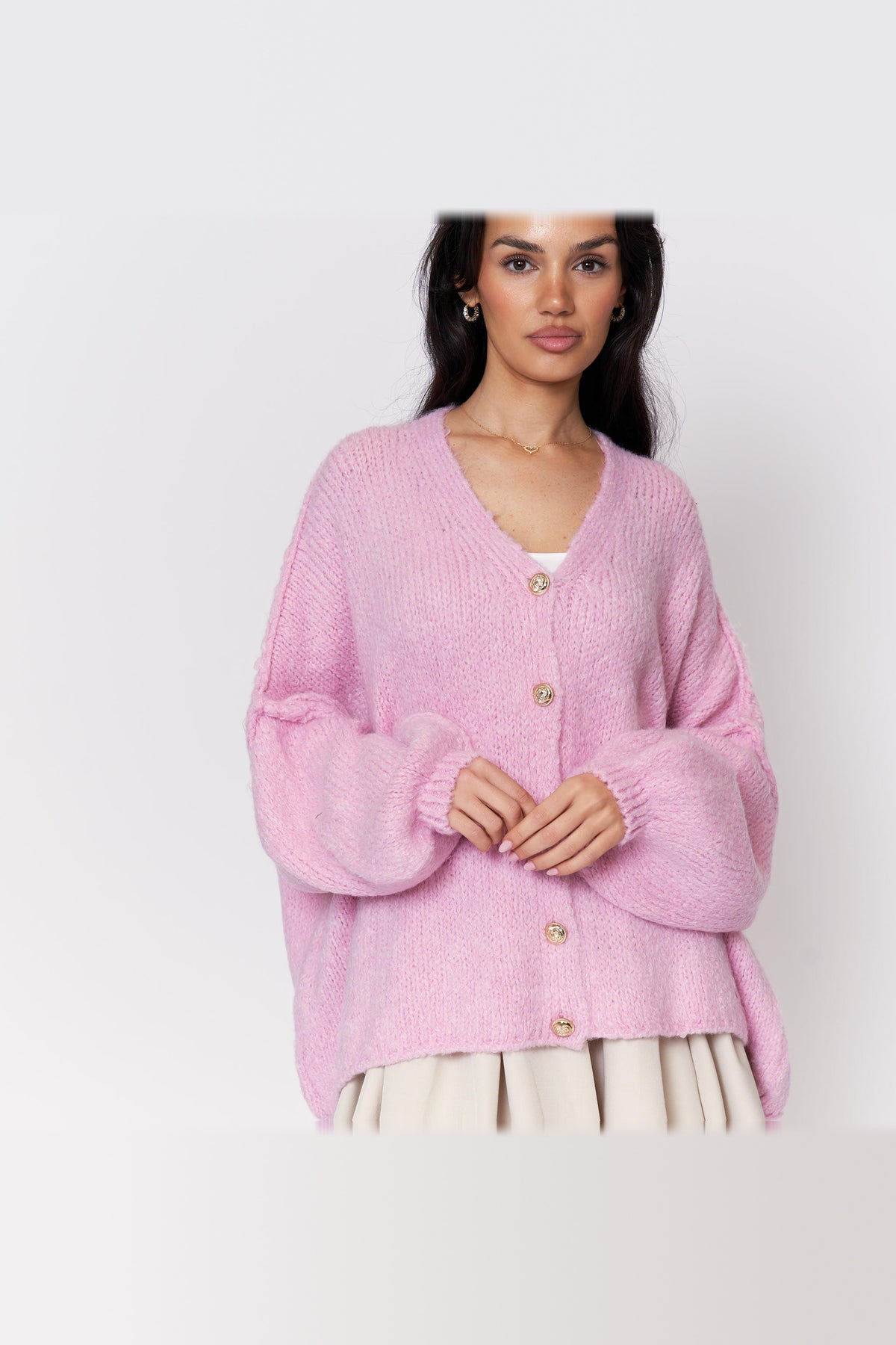 Cárdigan oversize de punto con escote de pico en rosa