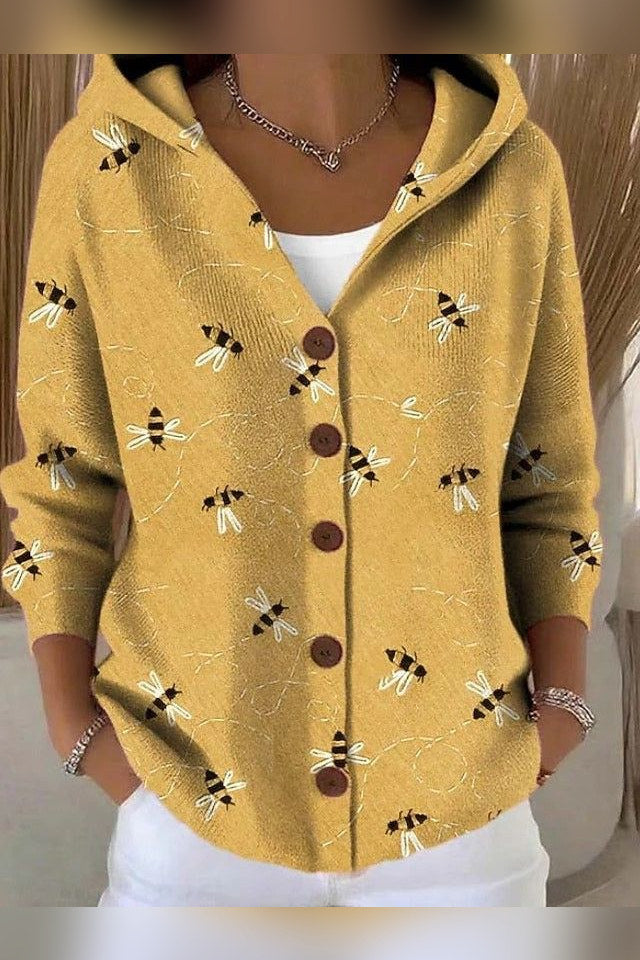 Chaqueta de punto estampada con capucha en amarillo